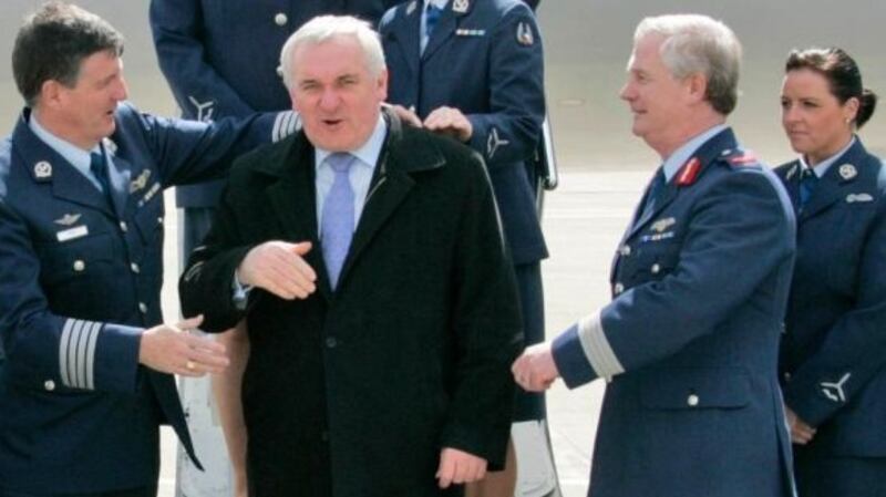 Lisa Smith (extreme right) pictured near the Govermnet jet with Defence Forces colleagues and the then taoiseach Bertie Ahern. She resigned from the Air Corps in 2011. Photograph: Collins