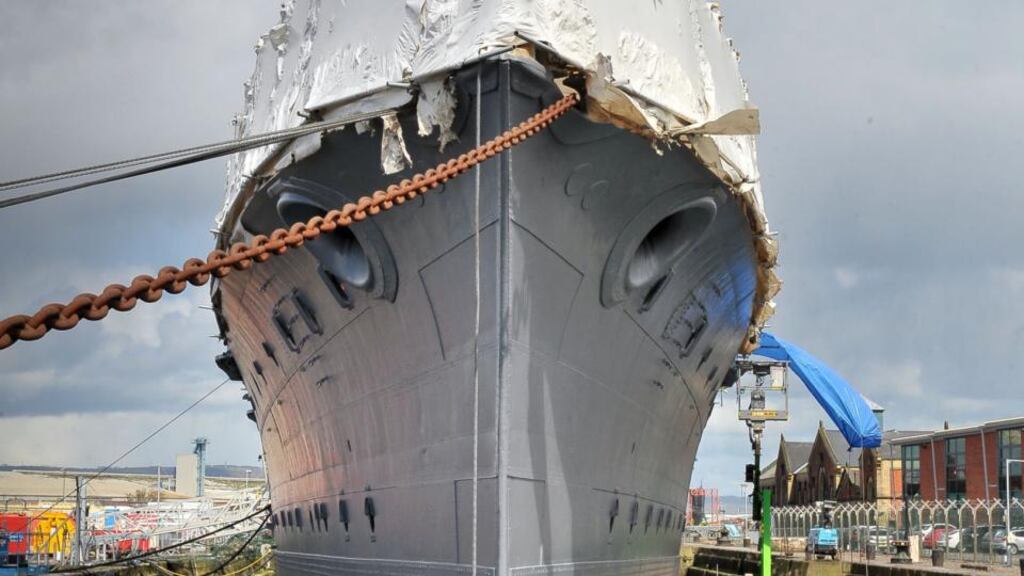 HMS ‘Caroline’: specialist workers from Britain, Ireland and Poland are working hard to ensure it is ready for unveiling on May 31st. Photograph: Justin Kernoghan/Photopress Belfast