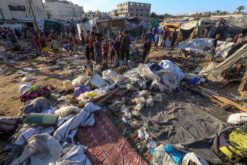 Internally displaced Palestinians inspect destroyed shelters following an Israeli military strike near Al-Aqsa Martyrs Hospital in Deir Al Balah, central Gaza. Photograph: Mohammed Saber/EPA