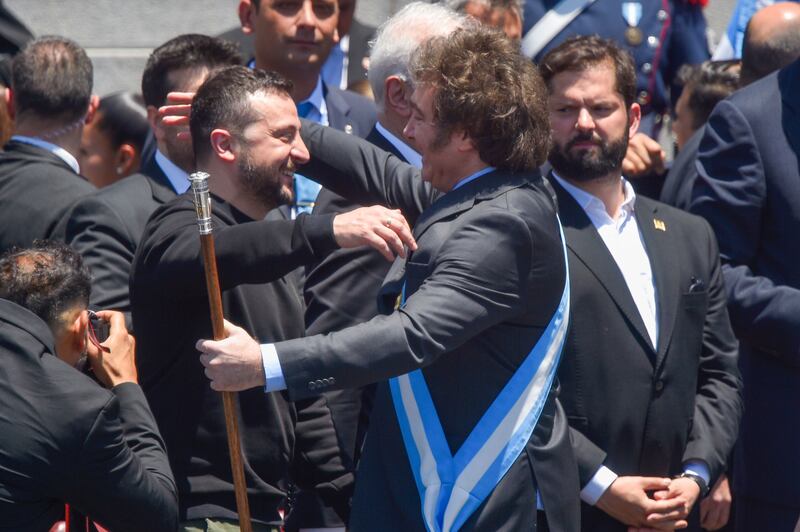 Ukraine’s president Volodymyr Zelensky embraces Argentina’s newly sworn-in president Javier Milei. Photograph: Gustavo Garello/AP