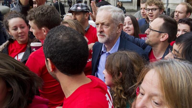 Labour Party leadership candidate Jeremy Corbyn (centre) is mobbed by supporters as he arrives to attend the ballot result. Photograph: Getty