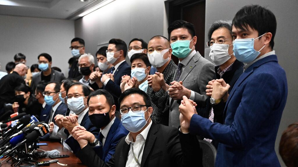 Pro-democracy lawmakers join hands at the start of a press conference in a Legislative Council office in Hong Kong on Wednesday. Photograph: Anthony Wallace/ AFP/Getty Images