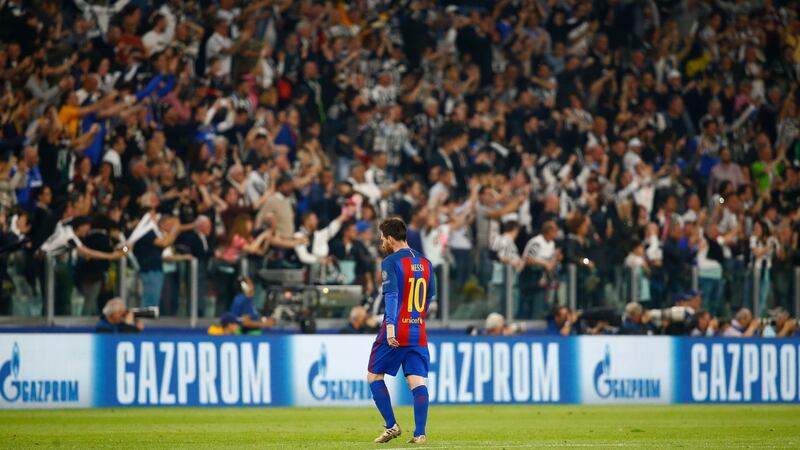 Messi walks away dejected as Juventus fans celebrate. Photo: Stefano Rellandini/Reuters