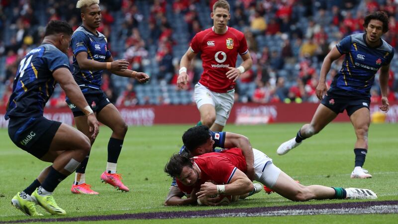 Robbie Henshaw crosses to score the Lions’ third try against Japan in Edinburgh. Photograph: Ian MacNicol/Getty