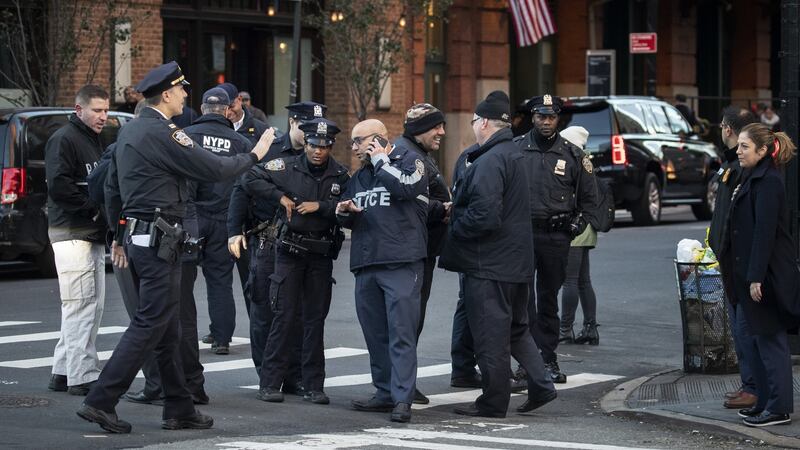Law enforcement officials gather near the scene of where a suspected bomb was found early on Thursday morning at Robert De Niro’s TriBeCa Grill restaurant in New York. Photograph: Drew Angerer/Getty Images