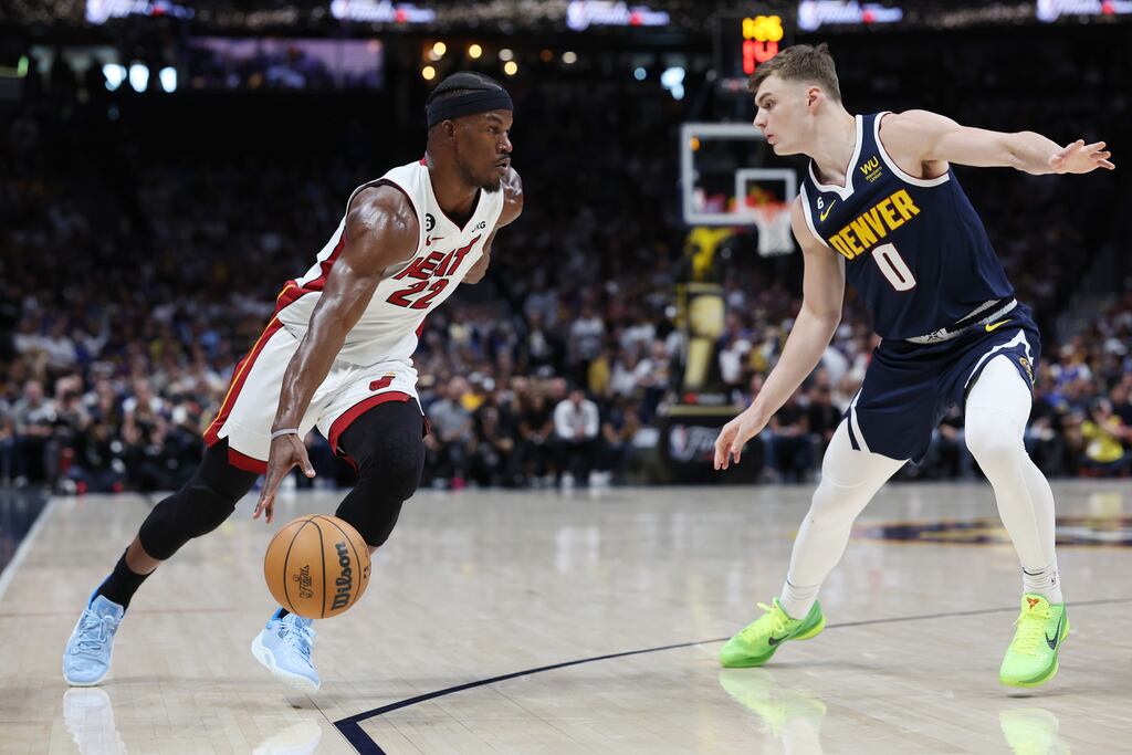 Jimmy Butler of the Miami Heat dribbles against Christian Braun of the Denver Nuggets during the first quarter in Game 2 of the 2023 NBA Finals at Ball Arena in Denver, Colorado. Photograph: Matthew Stockman/Getty Images