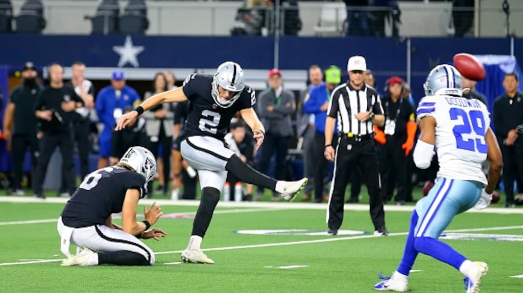 Daniel Carlson kicks the winning field goal in overtime against the Dallas Cowboys. Photograph: Richard Rodriguez/Getty Images