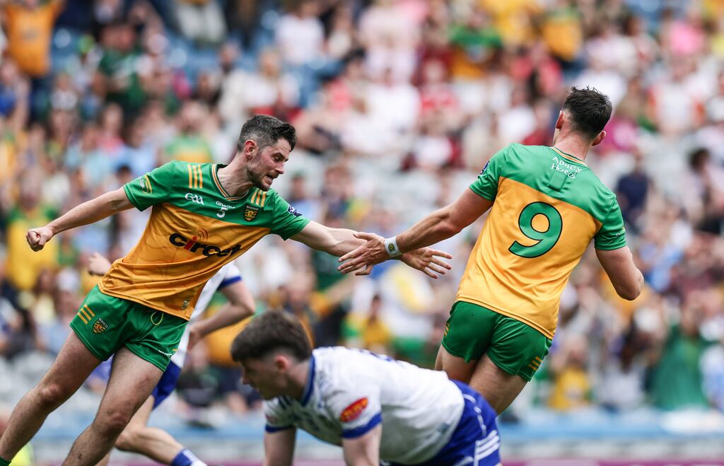 Donegal's Michael Langan celebrates with Ryan McHugh after scoring his side's first goal against Monaghan on Saturday. Photograph: Tom Maher/Inpho