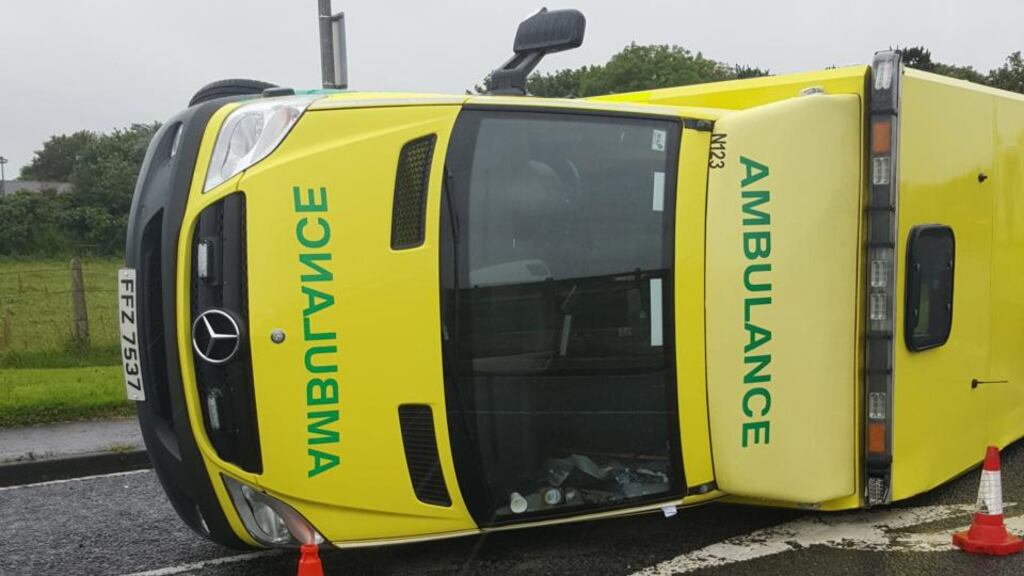 No one seriously injured after ambulance was flipped on its side after it collided with a car close to Portrush. Photograph: NIAS/PA Wire