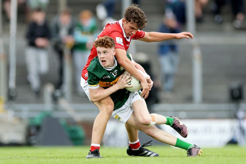 Kerry's Nick Lacey is challenged by Cork's Matthew Kiernan. Photograph: Laszlo Geczo/Inpho