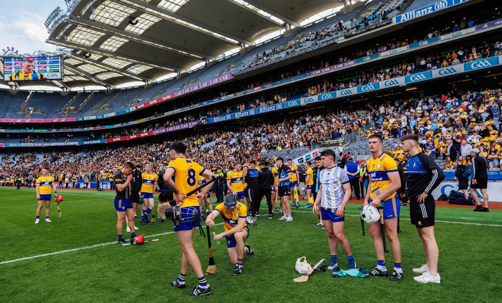 Clare's team dejected after losing to Kilkenny. Photograph: James Crombie/Inpho