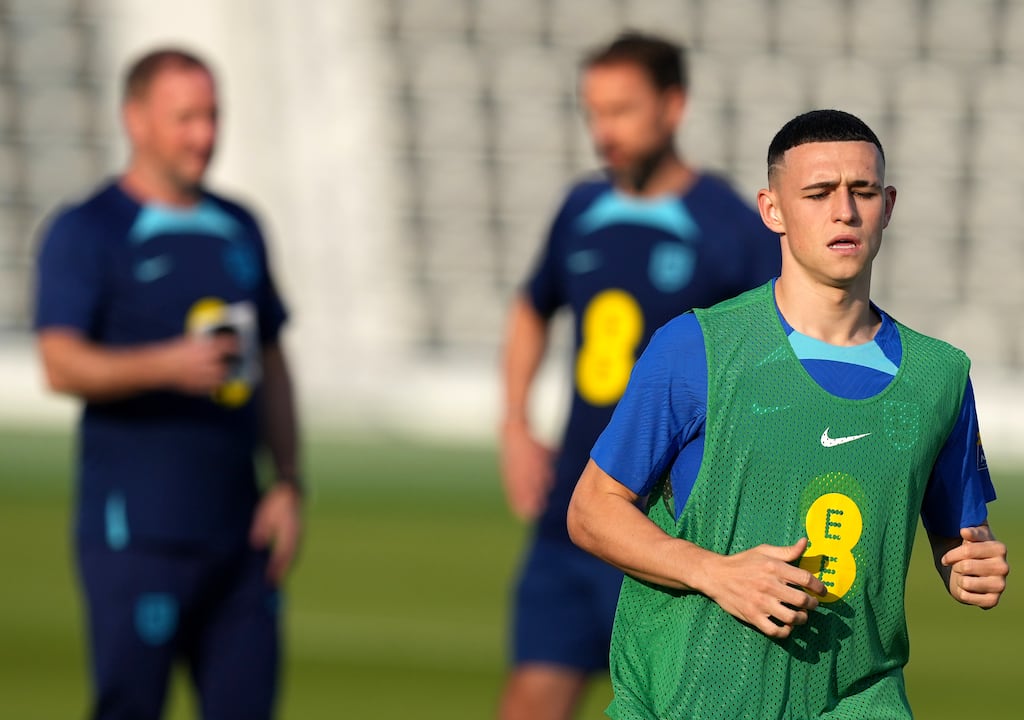 England's Phil Foden, with manager Gareth Southgate in the background, during a training session at the Al Wakrah sports complex in Qatar. Photograph: PA