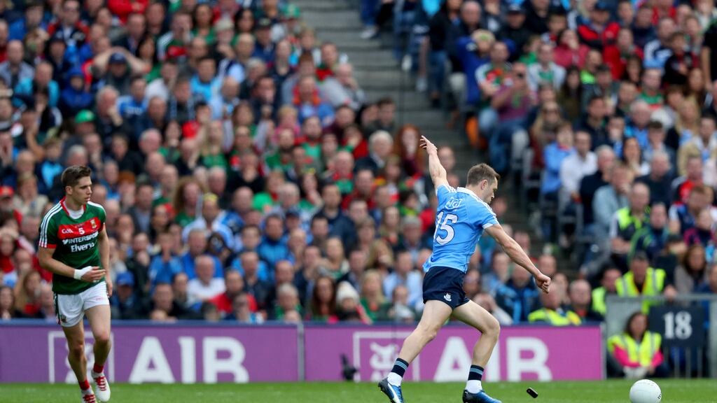 Dublin’s Dean Rock kicks the winning point. Photograph: James Crombie/Inpho