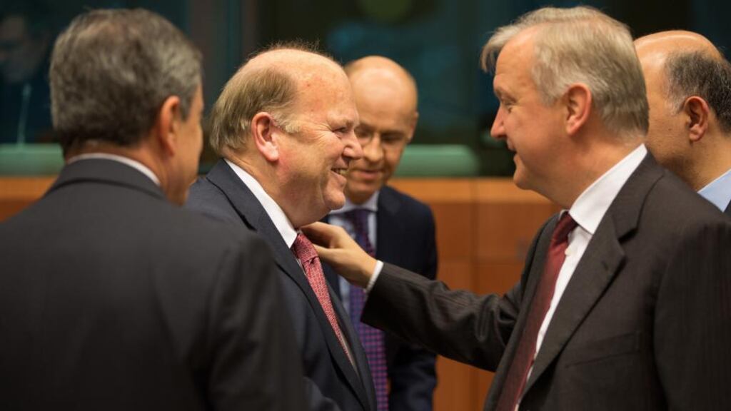 Michael Noonan with EU commissioner for economic and monetary affairs Olli Rehn in Brussels yesterday. Photograph: Peter Cavanagh
