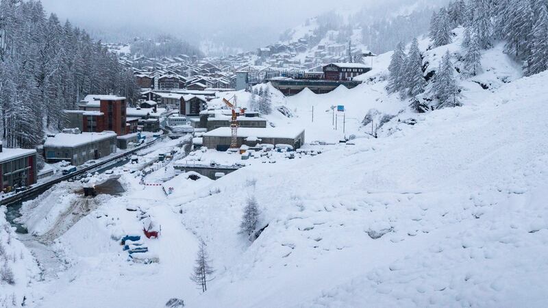 An avalanche near the heliport of Air Zermatt in Zermatt, Switzerland. Photograph: Dominic Steinmann/EPA