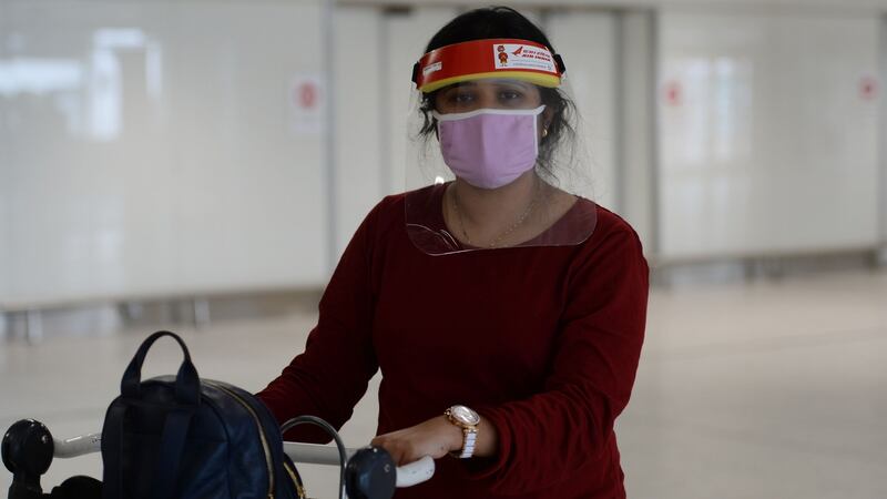 Akshara Anu James, who works as a nurse in a Dubli n Hospital, one of over 50 health care professionals who arrived in to Dublin Airport on a flight from India.Photograph: Alan Betson