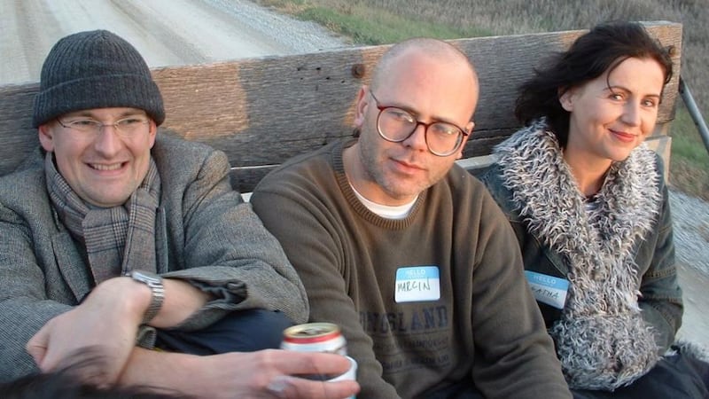 Chris Merrill, the IWP’s mercurial director German poet Matthias Göritz, Polish poet Marcin Sendecki, and Polish philosopher Agata Bielik-Robson on a harvest hayride as guests of the International Writing Programme in 2003. Photograph: Paddy Woodworth