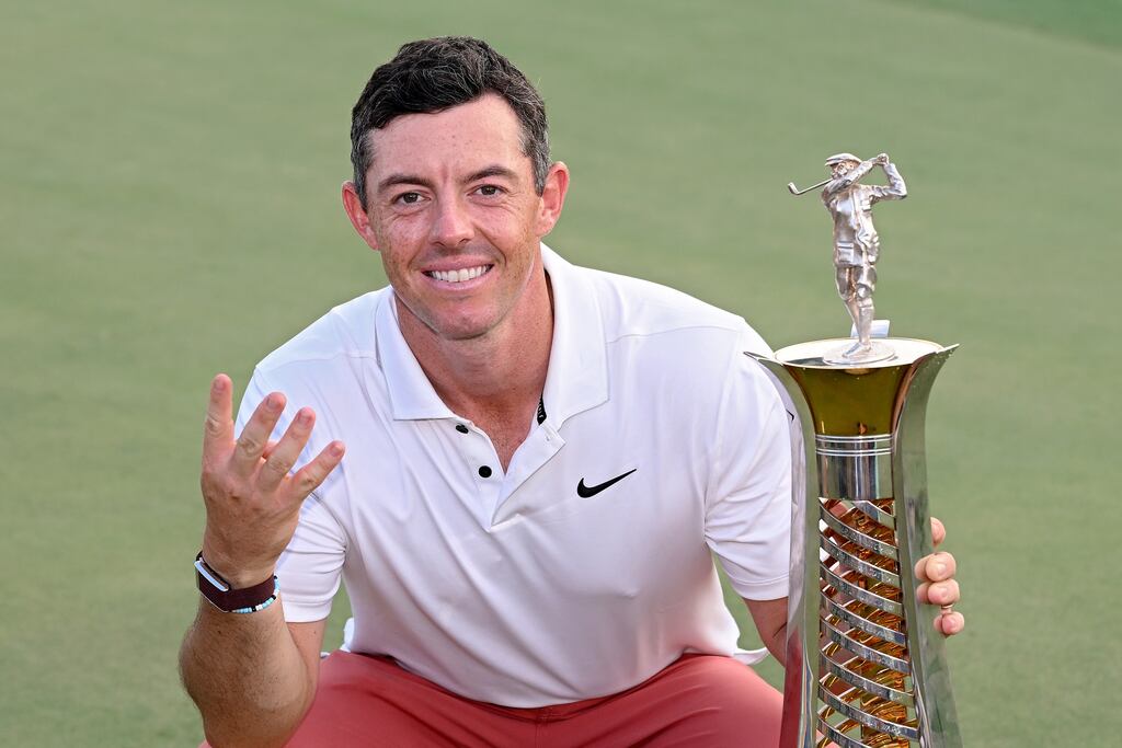 Rory McIlroy poses after winning the year-long Race to Dubai. Photograph: Ross Kinnaird/Getty