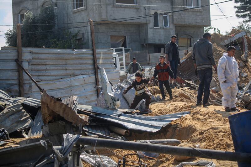 People inspect the damage to their homes following Israeli air strikes on February 20th in Rafah, Gaza. Photograph: Ahmad Hasaballah/Getty