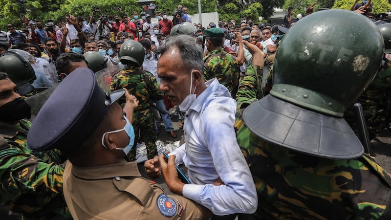 Government supporters clash with security forces during a protest near the prime minister’s house in Colombo, Sri Lanka. Photograph: Chamila karunarathne/EPA