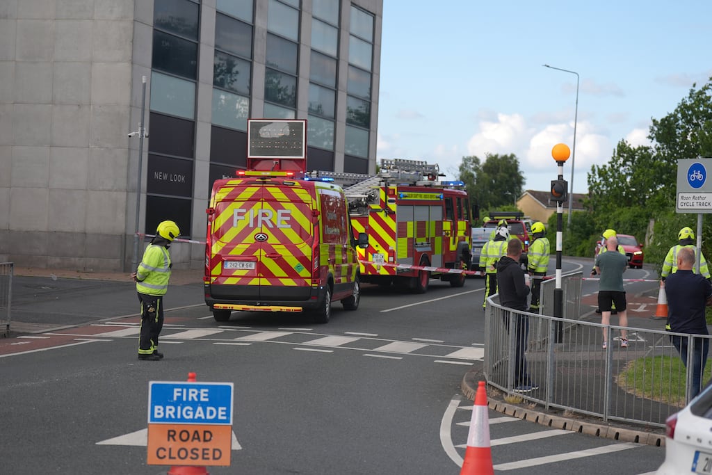 Gardaí rushed to the scene at Fairgreen Shopping Centre earlier on Sunday evening. Photograph: Niall Carson/PA Wire