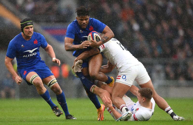 Jonathan Danty of France is tackled by England's Henry Slade at Twickenham. Danty was outstanding for the visitors. He provides the glue that attaches all the other parts to the central attacking mechanism. Photograph: Mike Hewitt/Getty Images