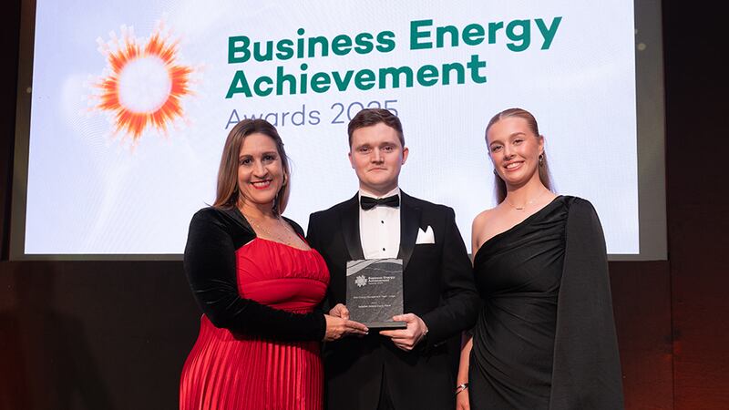 Katherine Valery, awards judge, presents the best energy management team - large to Daniel Walsh and Shannon Foster, Astellas Ireland Kerry Plant