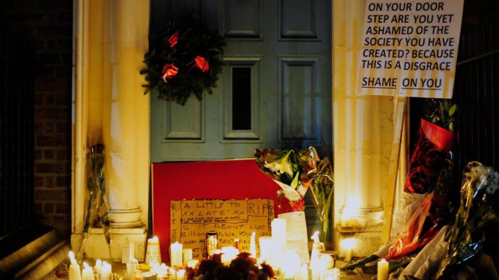 Candles outside the doorway on Molesworth street where Jonathan Corrie was found dead. Photograph: Aidan Crawley