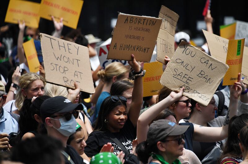 Abortion rights activists hoist their signs outside the US supreme court in Washington DC.  Photograph: Getty Images