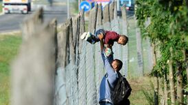 Migrants leave border camp and stranded train in Hungary