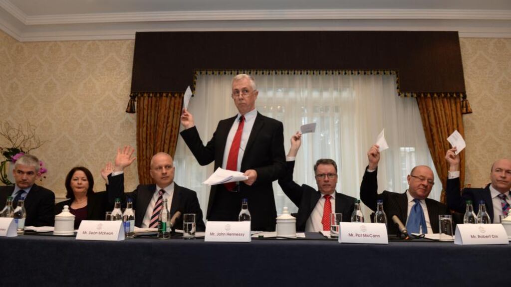 John Hennessy (standing) with from left; Dermot Crowley, Margaret Sweeney, Sean McKeon, Pat McCann, Robert Dix and Alf Smiddy at the Dalata Hotel Group meeting. Photograph: Dara Mac Dónaill