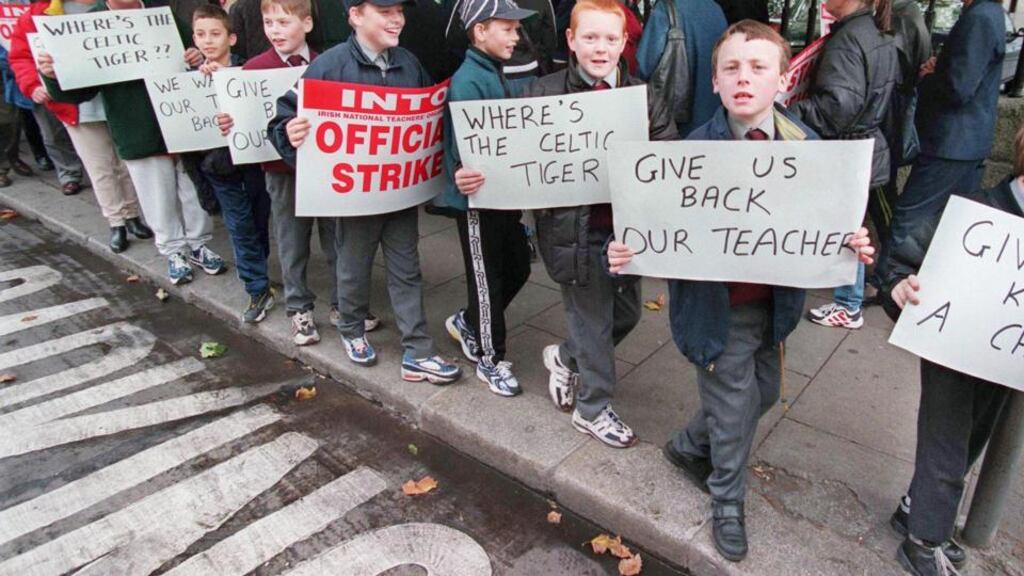 A protest over teacher staffing cuts outside the Department of Education