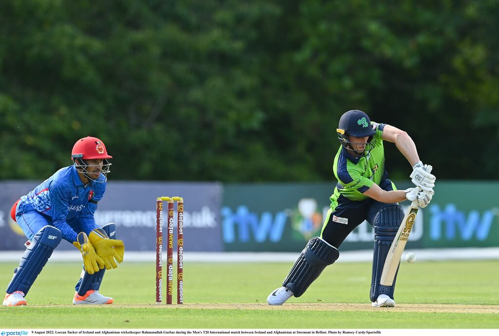 Lorcan Tucker of Ireland and Afghanistan wicketkeeper Rahmanullah Gurbaz during the Men's T20 International match between Ireland and Afghanistan at Stormont in Belfast. Photograph: Ramsey Cardy/Sportsfile