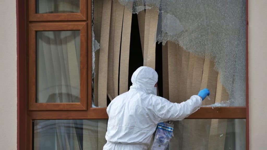 A garda examines the house  at Redford Park, Greystones, Co Wicklow,  where a man  was shot and injured at the front door of his  home on Monday night. Photograh: Colin Keegan/Collins