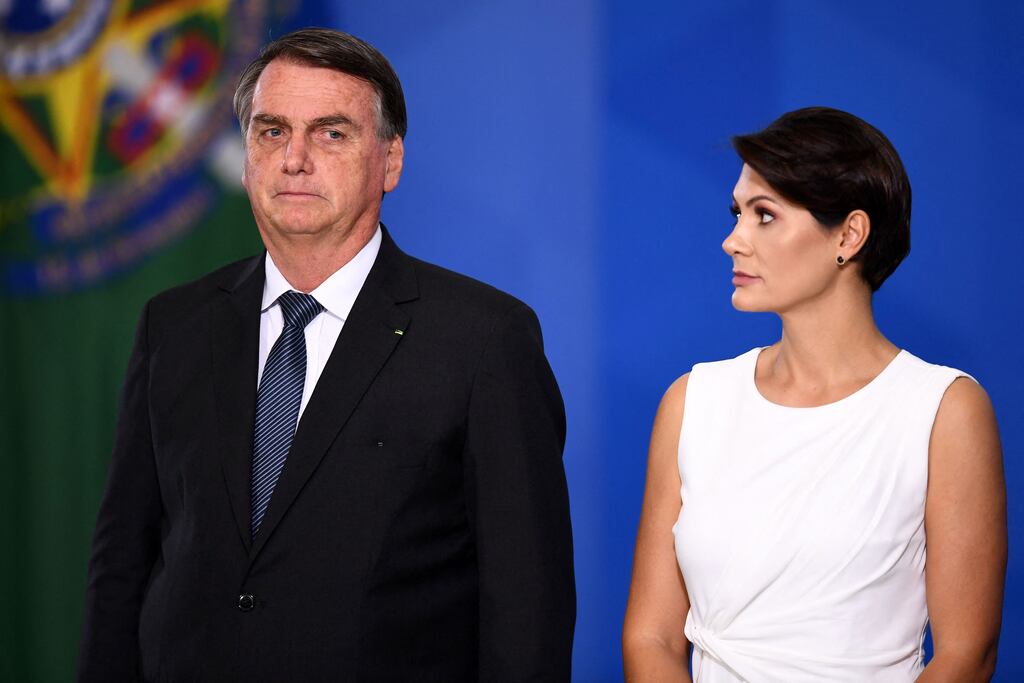 Brazilian president Jair Bolsonaro stands next to his wife Michelle during the promotion ceremony of General Officers of the Armed Forces, at Planalto Palace in Brasilia, on August 4th. Photograph: Evaristo Sa/AFP via Getty Images