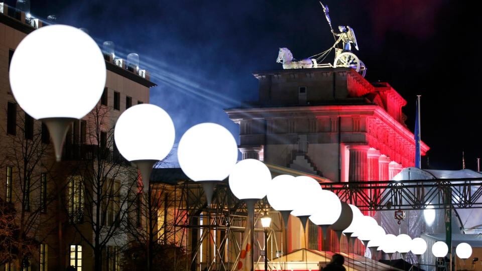 Lit balloons are placed along the former Berlin Wall location near the Brandenburg Gate in Berlin. The light installation ‘Lichtgrenze’ (Border of Light) features 8000 luminous white balloons to commemorate the 25th anniversary of the fall of the Berlin Wall. Photograph: Fabrizio Bensch/Reuters