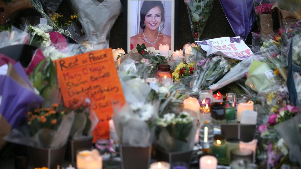 Flowers and messages and candles are left at a memorial outside Leinster House for Ashling Murphy who was murdered in Tullamore on Wednesday evening. Photograph: Collins Photos