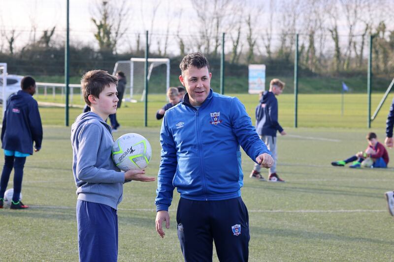Football For All: Coach Phil Pierce and his son William, who is part of the team at East Meath United. Photograph: Dara Mac Dónaill