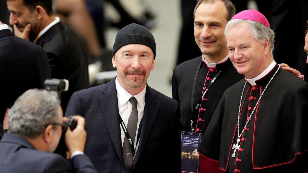 U2 guitarist The Edge, whose real name is David Evans, poses with Irish bishop Paul Tighe before listening to US vice-president Joe Biden speak at the Vatican. Photograph: Max Rossi/Reuters