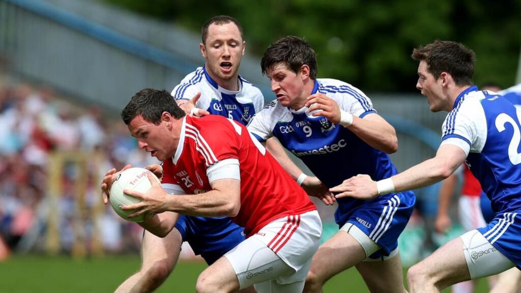 Tyrone’s Conor Gormley surrounded by Vinny Corey, Darren Hughes and Conor McManus of Monaghan during yesterday’s clash. Photograph: Donall Farmer/Inpho