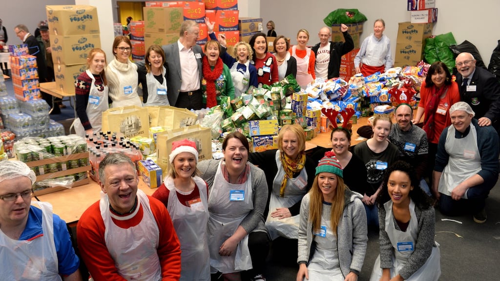 Staff at the goodie bag area at the Knights of Columbanus homeless dinne at the RDS today. Photograph: Cyril Byrne/The Irish Times