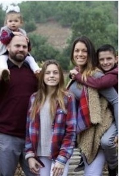 Hannah Ahlers, second right, with her husband, Brian, and their three children