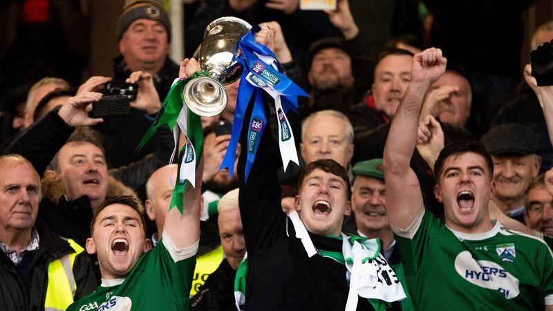 Niall Friel and Kieran Gillespie lift the Seamus MacFerran Cup after beating Scotstown. Photograph: Bryan Keane/Inpho
