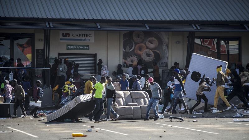 Rioters loot the Jabulani Mall in the Soweto district of Johannesburg on Monday, July 12th, 2021. South Africa said it was deploying troops to two provinces, including Johannesburg, after unrest sparked by the jailing of ex-president Jacob Zuma led to six deaths and widespread looting. Photograph: Luca Sola/AFP/Getty