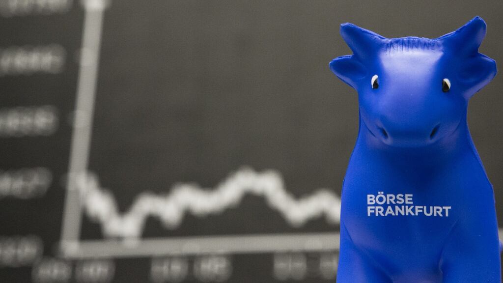 A toy bull sits in front of the DAX Index curve at the Frankfurt Stock Exchange in  Germany on Monday: financial markets started 2016 on a bleak note and China is at the centre of it. Photographer: Martin Leissl/Bloomberg
