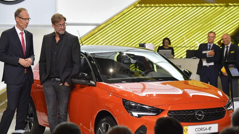 Michael Lohscheller (L), chairman of the Opel with Liverpool Football Club boss Juergen Klopp at the launch of the new Opel Corsa-e