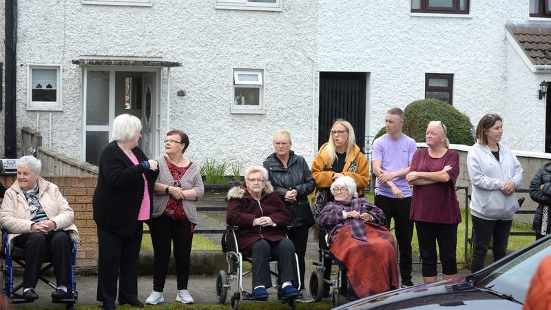 Neighbours and friends on Greencastle Crescent line street as the funeral cortege makes its way down following the funeral mass of Christine Keegan at Bonnybrook Parish, St Joseph the Artisan Church, Dublin. Photograph: Dara Mac Donaill/The Irish Times
