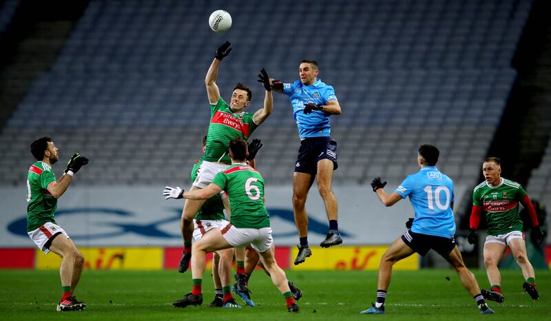 James McCarthy jumps with Mayo's Diarmuid O’Connor in the 2020 All-Ireland final. Photograph: Ryan Byrne/Inpho