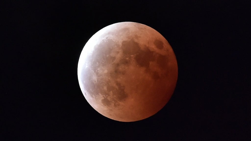 A file photo taken on October 8th, 2014 shows a lunar eclipse as seen from Tokyo. A total eclipse of the moon will occur in the early hours of Monday morning and Irish skywatchers will have an excellent chance of seeing it. Photograph: Yoshikazu TSUNO/AFP/Getty Images.