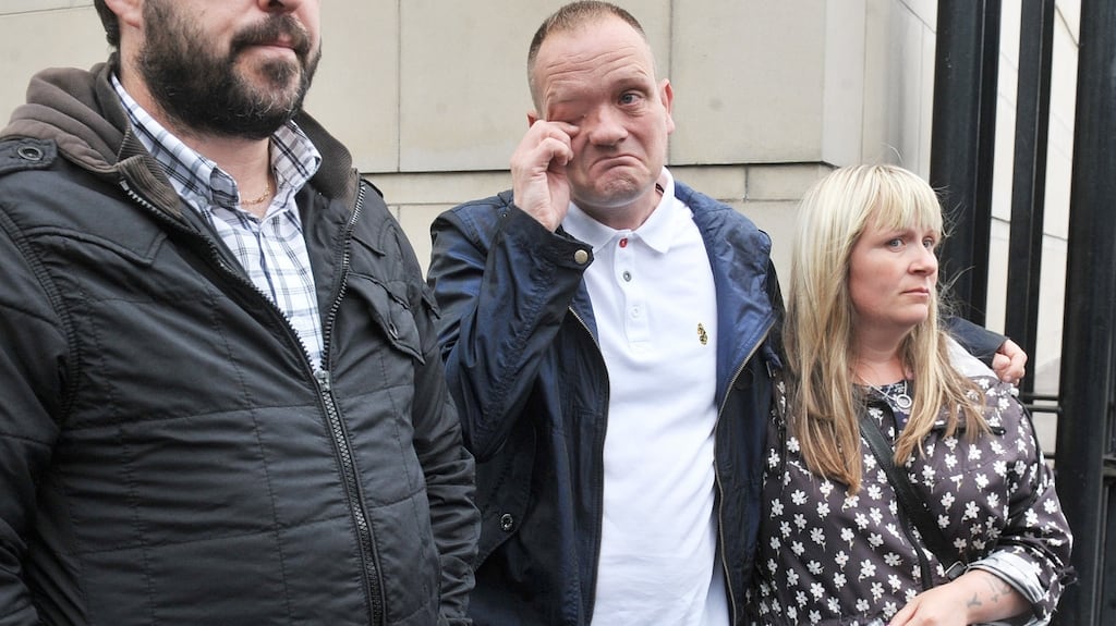 Aaron Harbinson (centre), son of Gary Haggarty’s victim John Harbinson outside Belfast Crown Court following the UVF man’s guilty pleas to over two hundred terrorism charges including five murders.